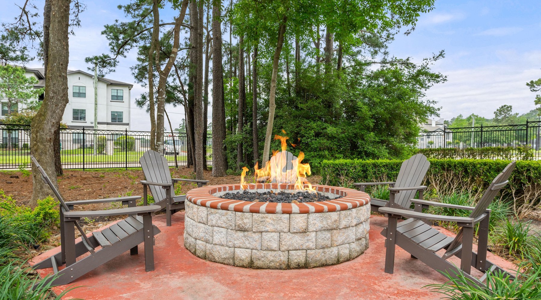 a fire pit with benches around it