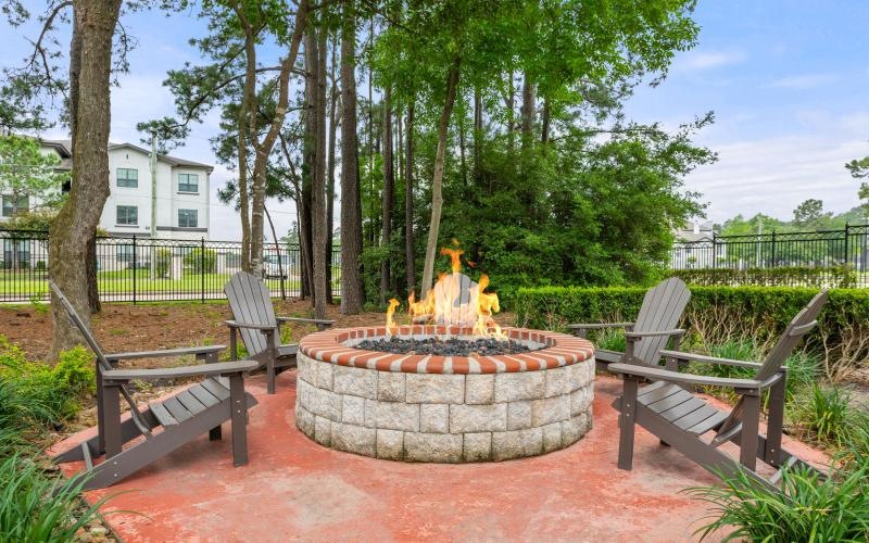 a fire pit with benches around it