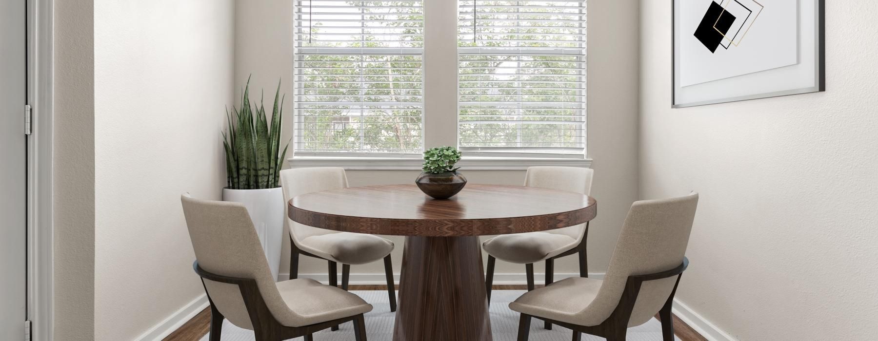 a dining room table with chairs around it