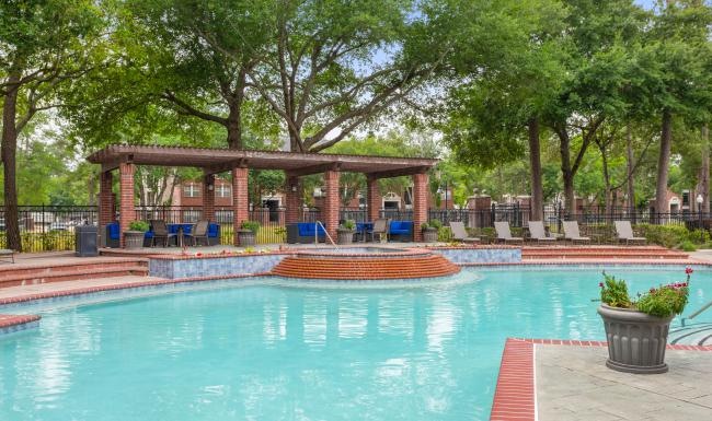 a swimming pool with a building in the background